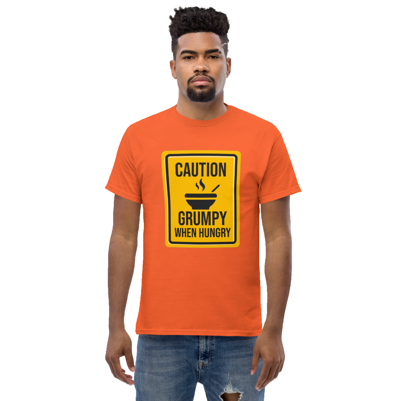 a man wearing an orange shirt with a caution sign on it