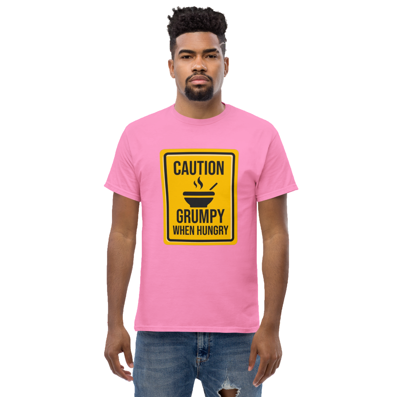 a man wearing a pink t - shirt that says caution is a grumpy