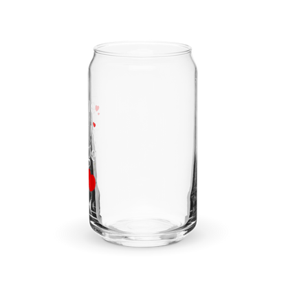 a clear glass with a red handle on a black background