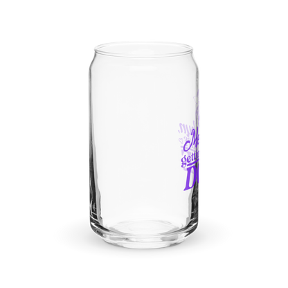 a clear glass with purple writing on it