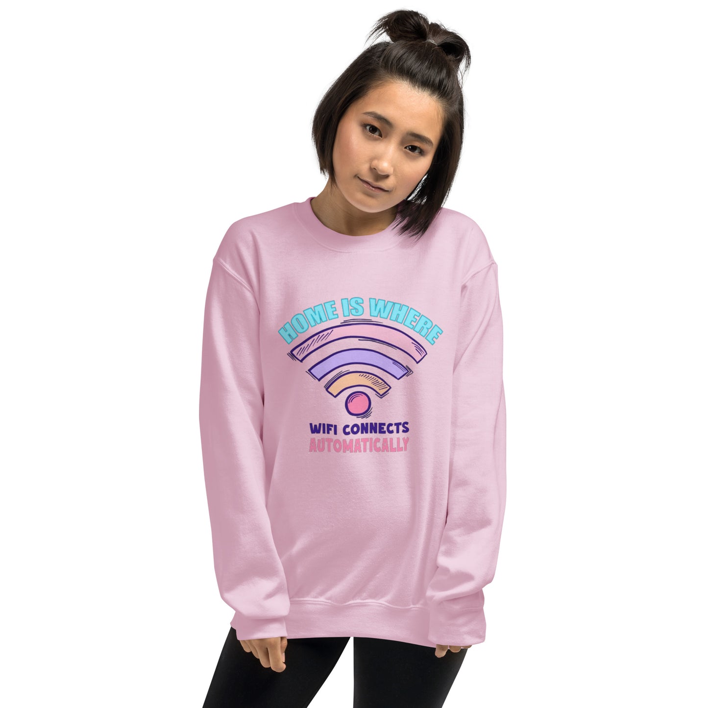 a woman wearing a pink sweatshirt with a rainbow on it